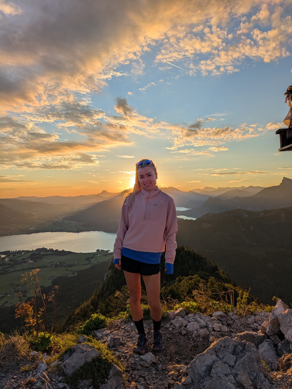 Jess, RETO's founder, on a summit at sunset